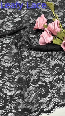 Tecido de renda de largura total em preto elegantes padrões florais e bordas enroladas para roupas de moda